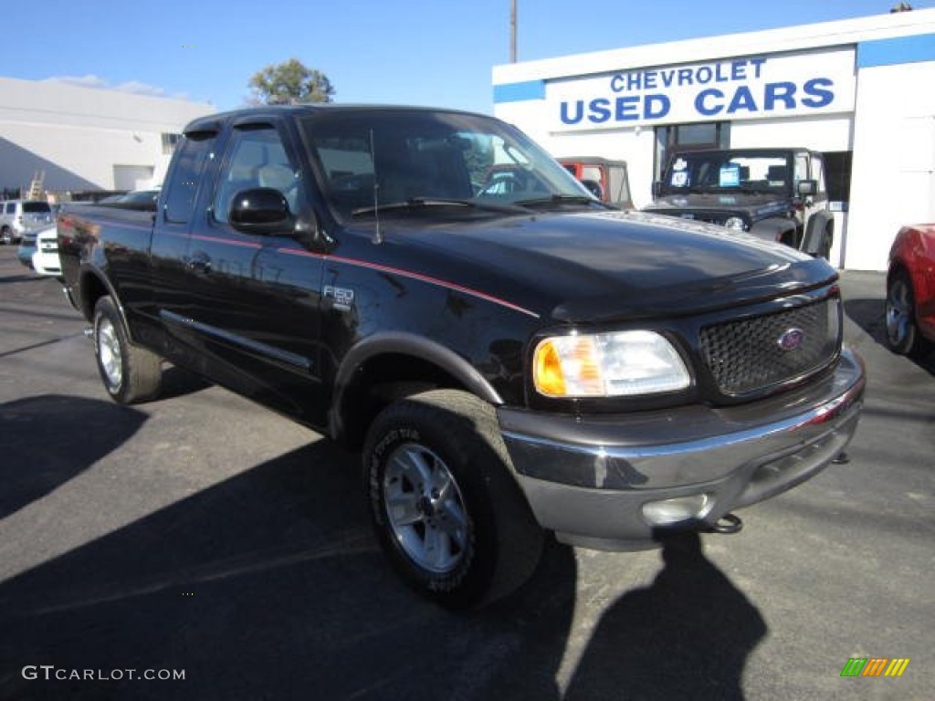 2002 F150 XLT SuperCab 4x4 - Black / Medium Graphite photo #1