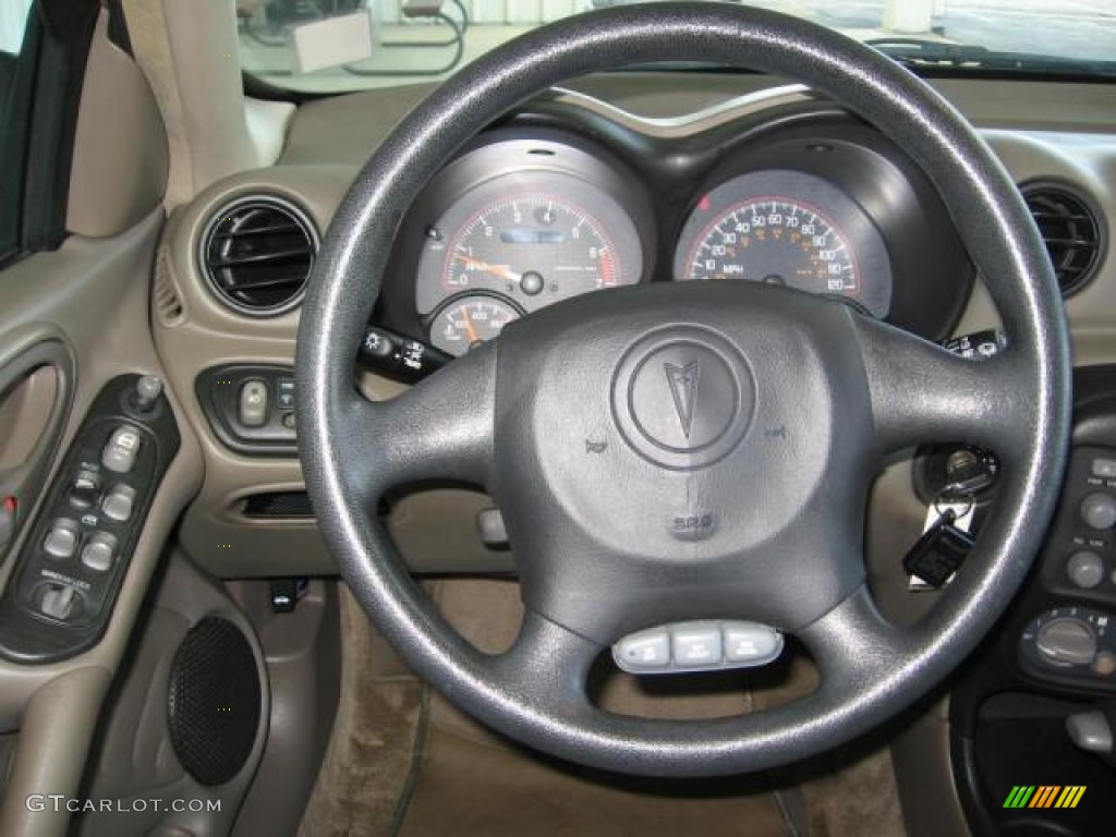 2005 Grand Am SE Sedan - Champagne Beige Metallic / Dark Taupe photo #5