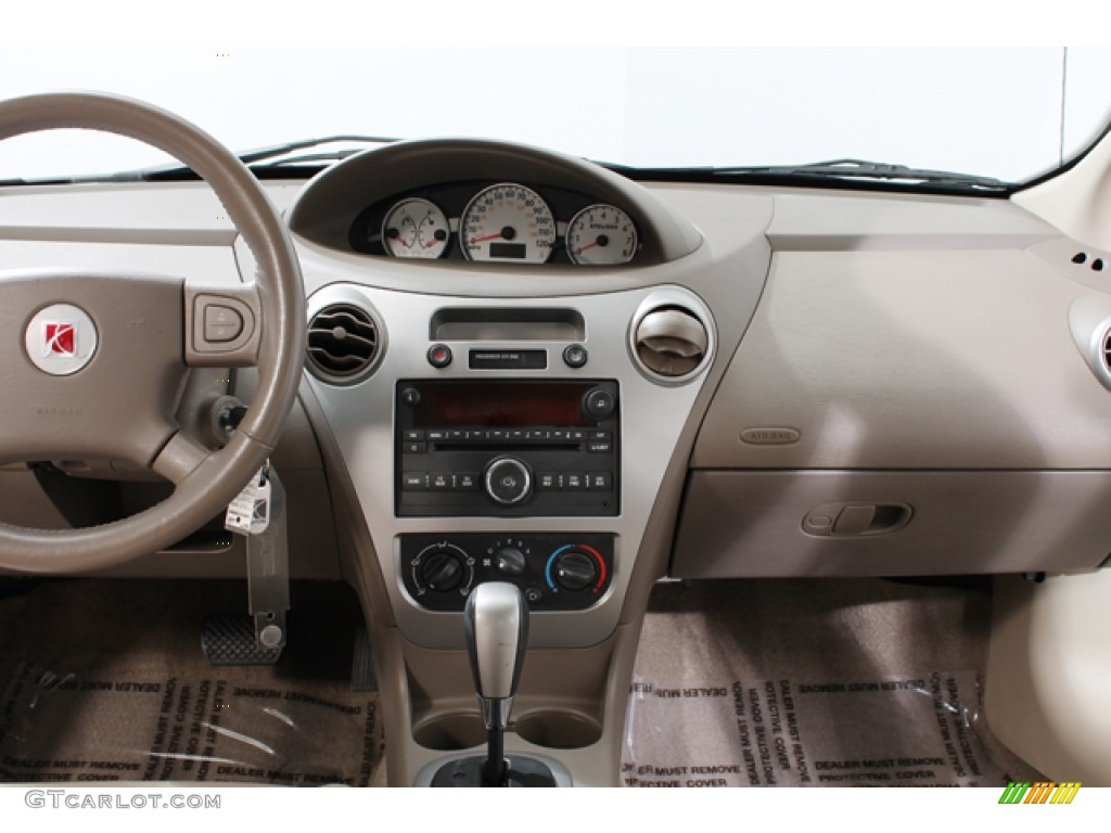 2006 Saturn ION 3 Sedan Beige Dashboard Photo #72350766