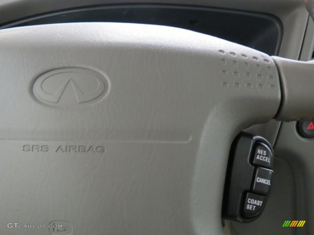 2001 QX4  - Tuscan Beige Metallic / Stone Beige photo #20