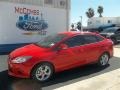 2013 Race Red Ford Focus SE Sedan  photo #1