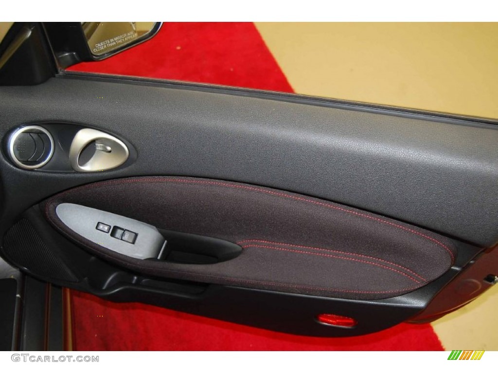 2010 Nissan 370Z NISMO Coupe NISMO Black/Red Cloth Door Panel Photo #72665753