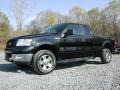 2005 Black Ford F150 XLT SuperCab 4x4  photo #1