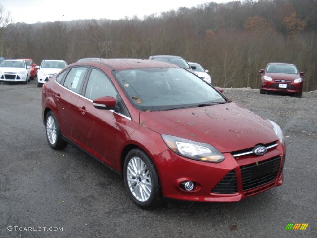 Ruby Red 2013 Ford Focus Titanium Sedan Exterior Photo #73081482
