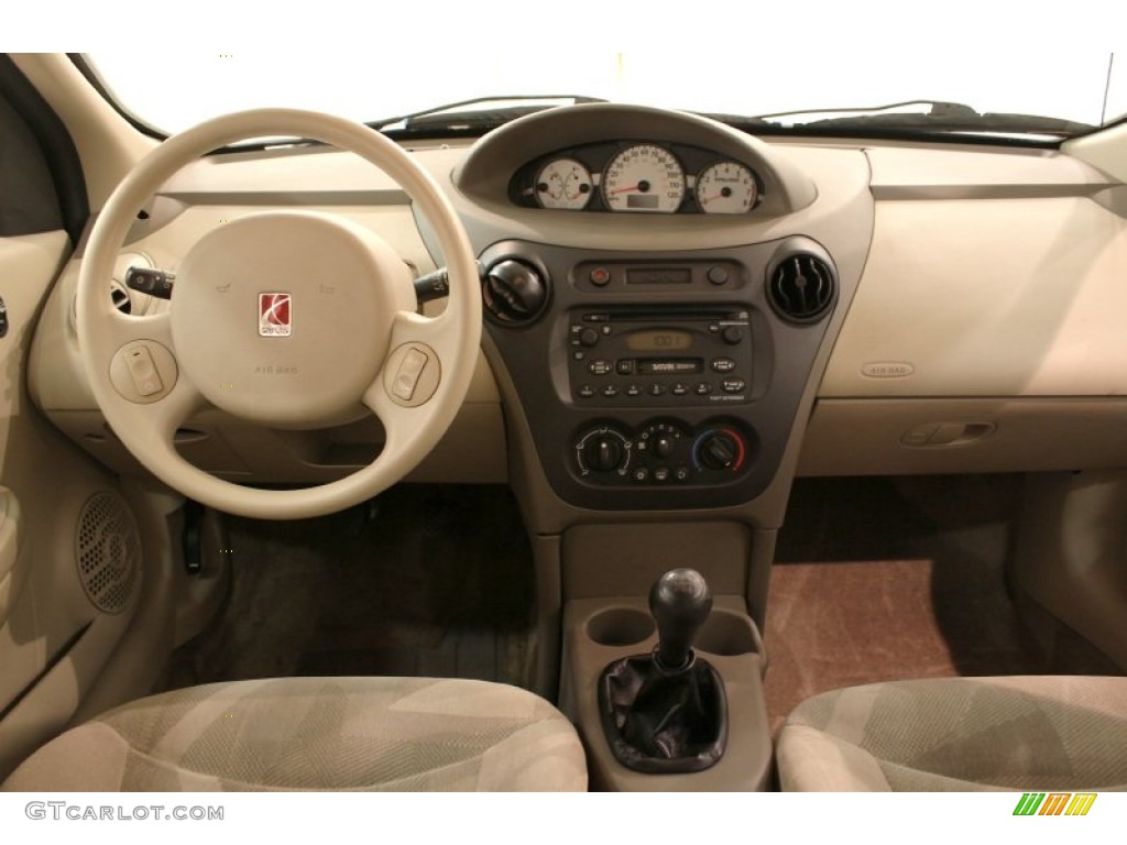 2003 Saturn ION 3 Sedan Tan Dashboard Photo #73175604