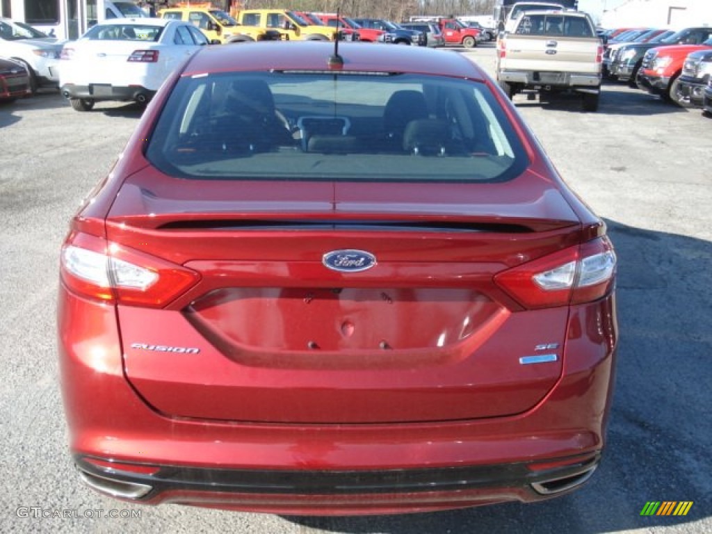 2013 Fusion SE 2.0 EcoBoost - Ruby Red Metallic / SE Appearance Package Charcoal Black/Red Stitching photo #7