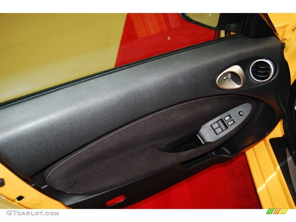 2009 Nissan 370Z Sport Coupe Black Cloth Door Panel Photo #73524822