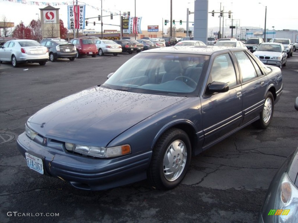 1997 Cutlass Supreme SL Sedan - Adriatic Blue Metallic / Graphite photo #2