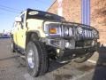 Yellow 2004 Hummer H2 SUV