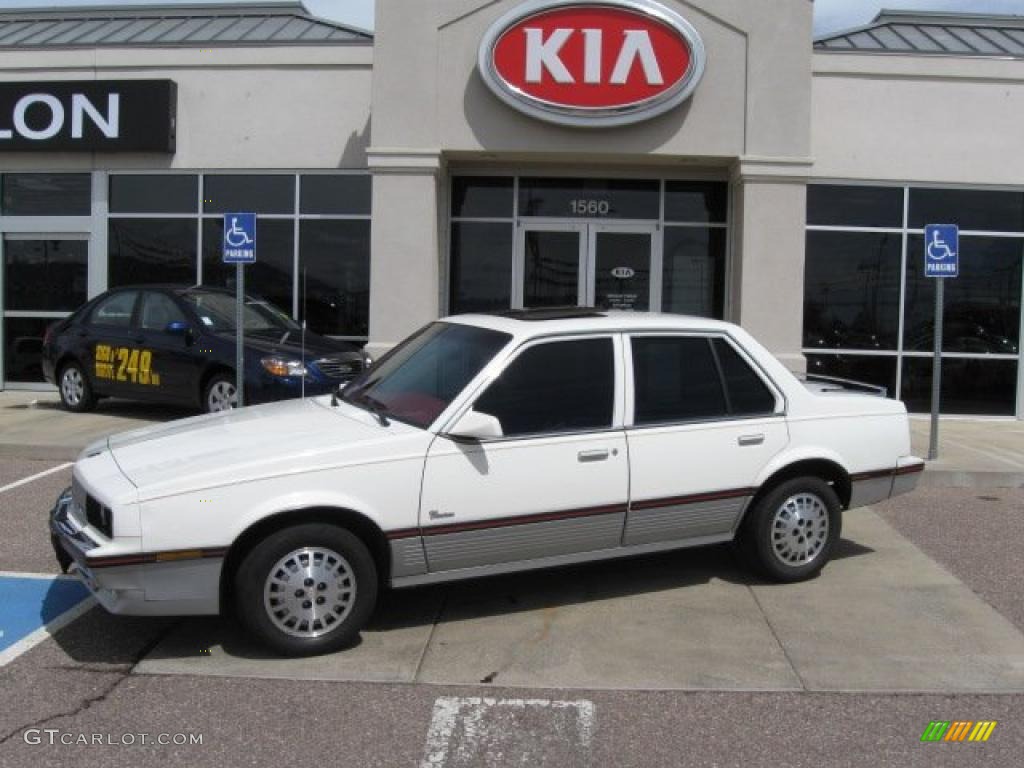 1985 Cimarron Sedan - White / Red photo #1