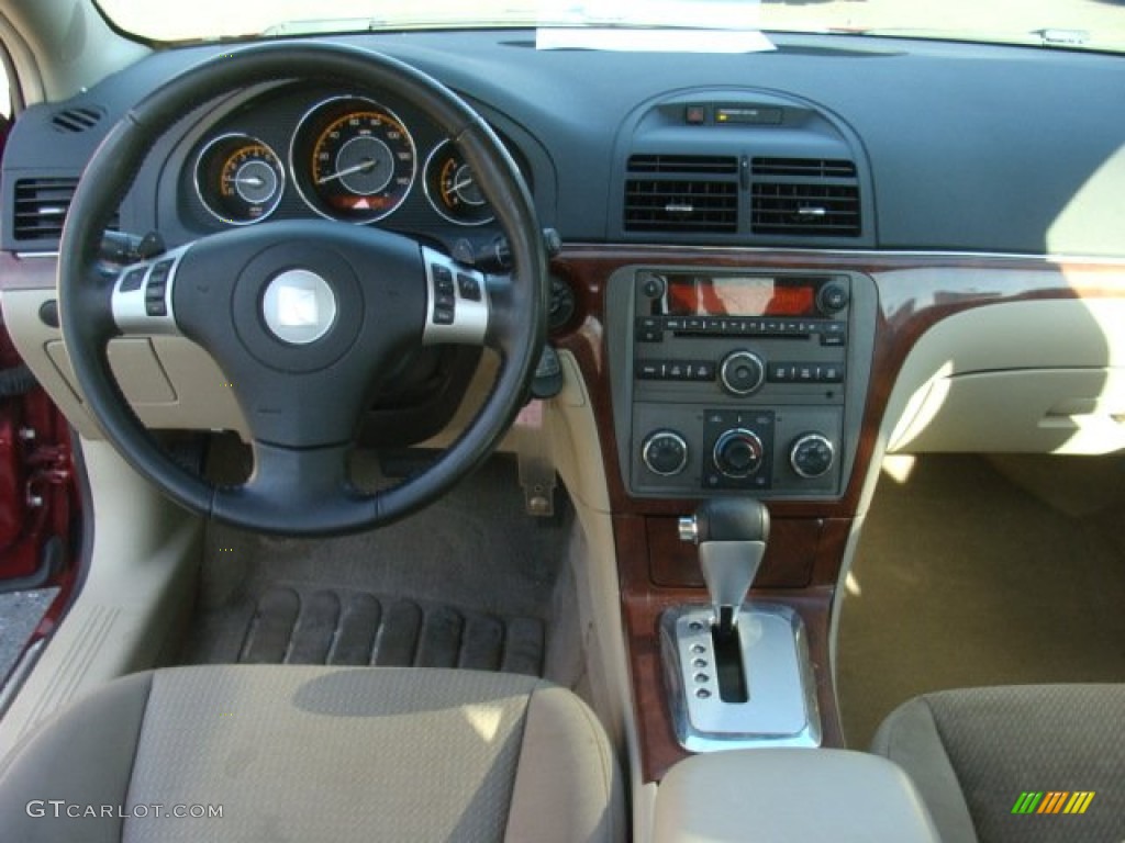 2009 Aura XE - Red Jewel Tintcoat / Tan photo #10