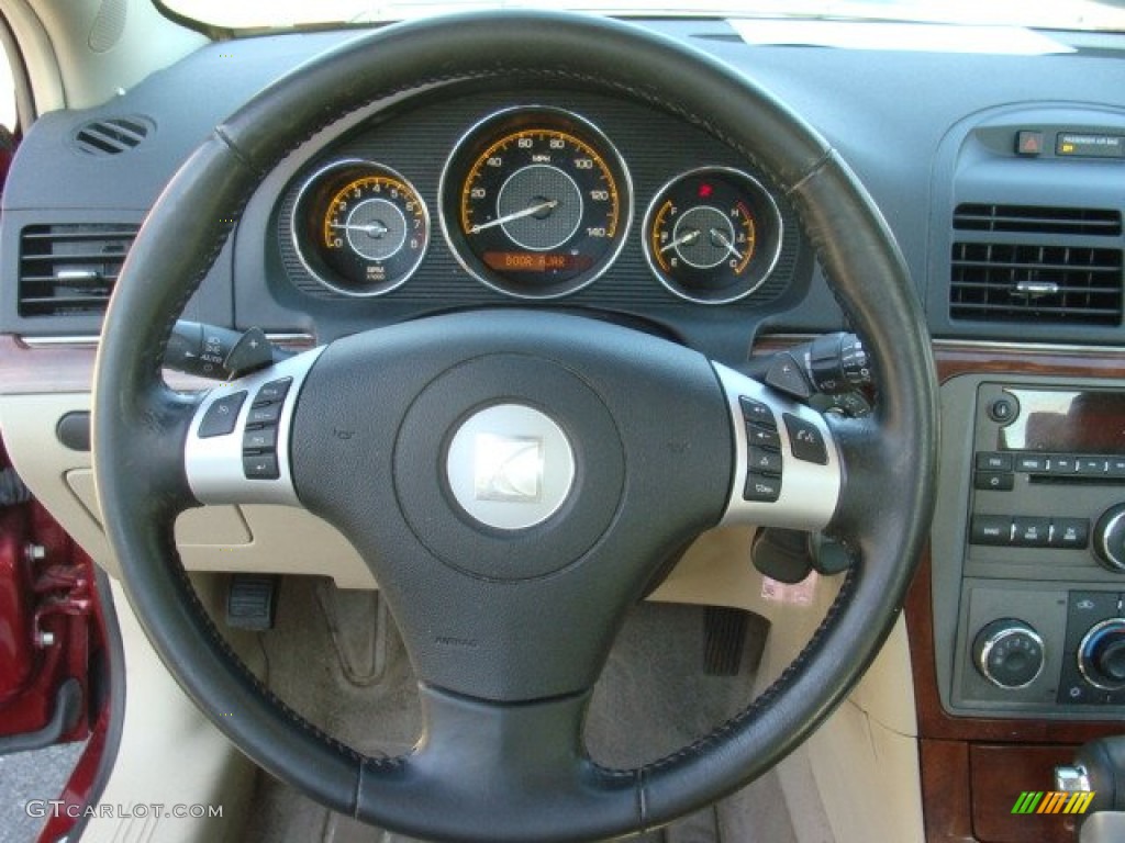 2009 Aura XE - Red Jewel Tintcoat / Tan photo #11