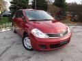 2011 Red Brick Nissan Versa 1.8 S Sedan  photo #1