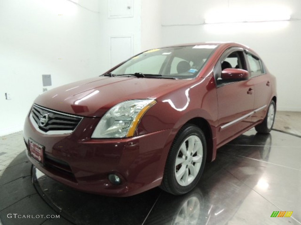 2010 Sentra 2.0 SL - Red Brick Metallic / Charcoal photo #1