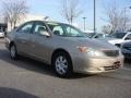 2003 Desert Sand Mica Toyota Camry LE  photo #1