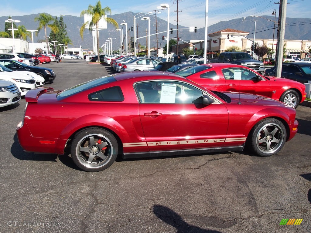 Redfire Metallic 2005 Ford Mustang V6 Deluxe Coupe Exterior Photo #74467099