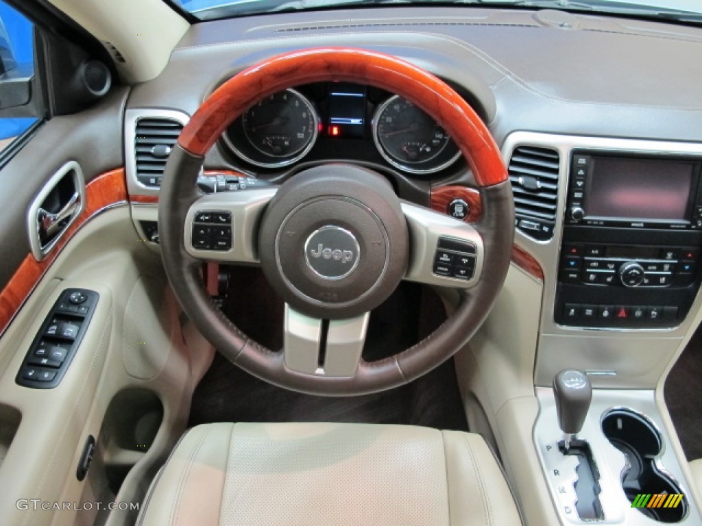 2012 Jeep Grand Cherokee Overland 4x4 Dark Frost Beige/Light Frost Beige Steering Wheel Photo #75351651