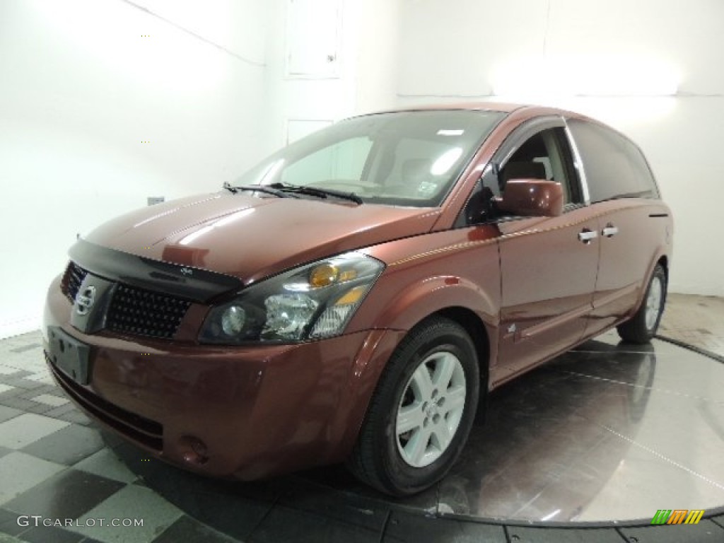 Autumn Red Metallic Nissan Quest