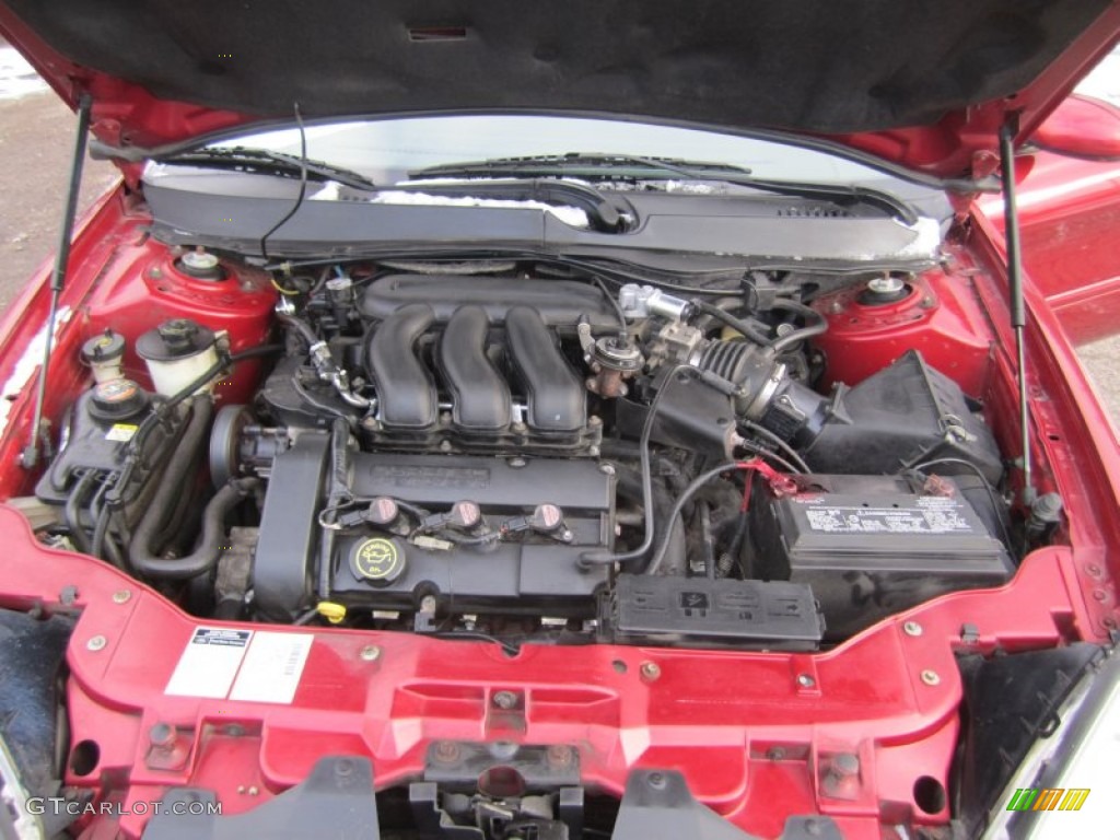 2000 Taurus SEL - Toreador Red Metallic / Medium Graphite photo #29