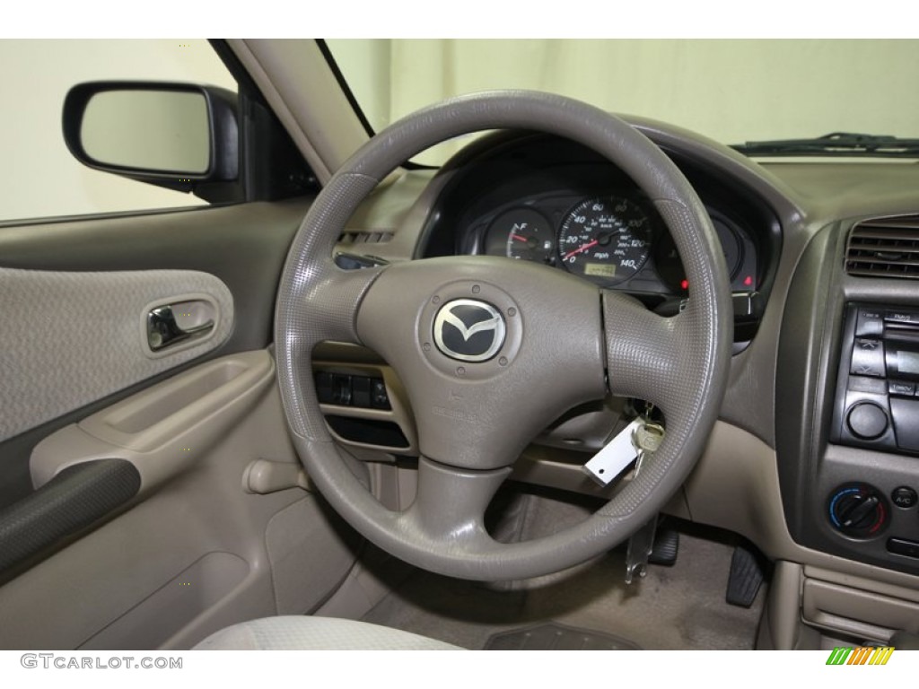 2003 Mazda Protege DX Beige Steering Wheel Photo #76384718