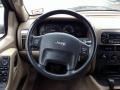 2003 Jeep Grand Cherokee Sandstone Interior Steering Wheel Photo