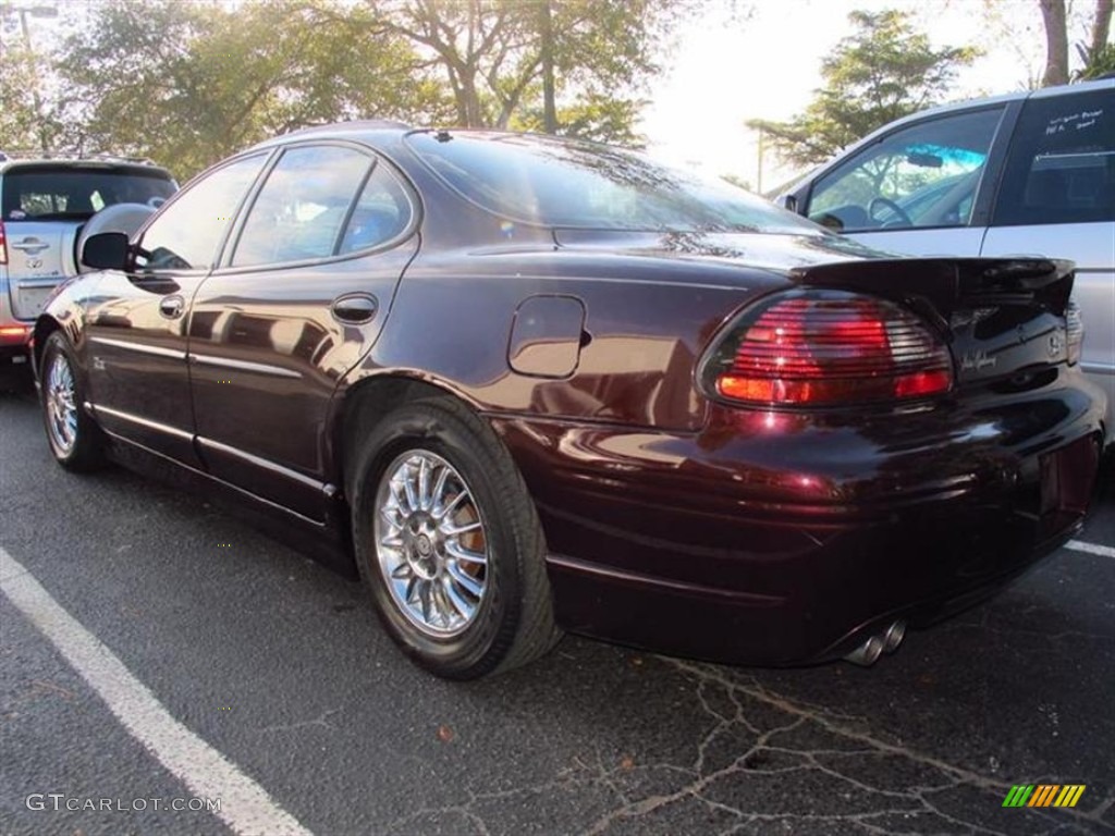 2002 Grand Prix GT Sedan - Dark Cherry Red Metallic / Ruby Red photo #2