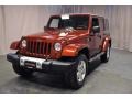 2010 Red Rock Crystal Pearl Jeep Wrangler Unlimited Sahara 4x4  photo #1