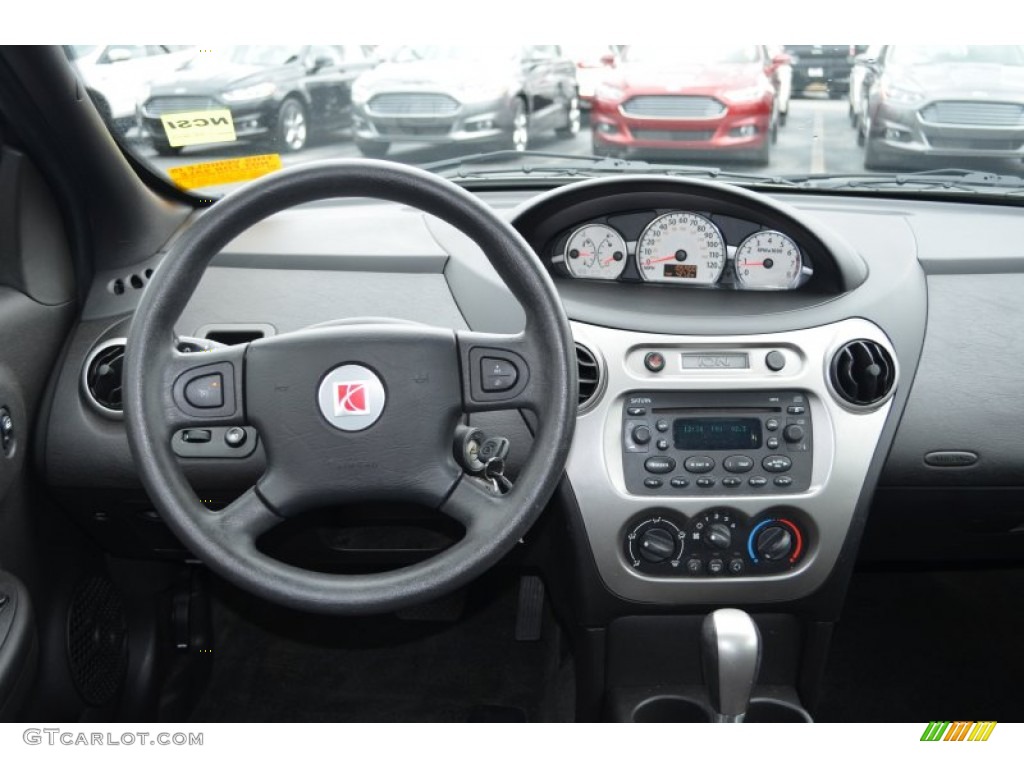 2005 Saturn ION 3 Quad Coupe Black Dashboard Photo #76598875