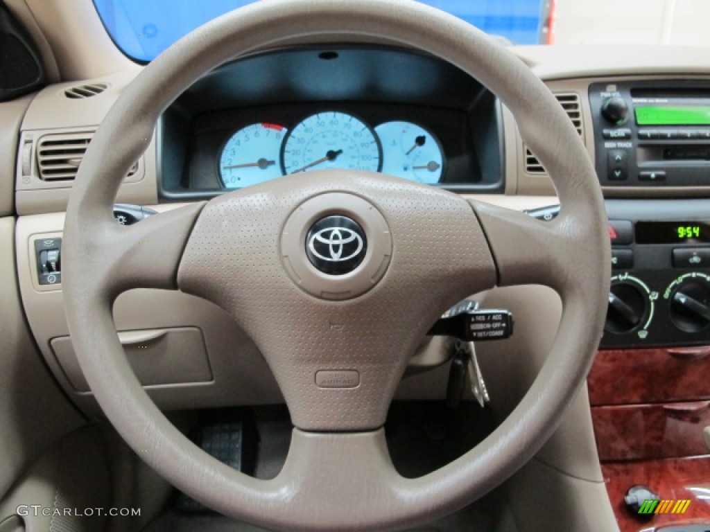 2004 Toyota Corolla LE Pebble Beige Steering Wheel Photo #76629837