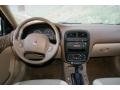 2002 Saturn L Series Medium Tan Interior Dashboard Photo