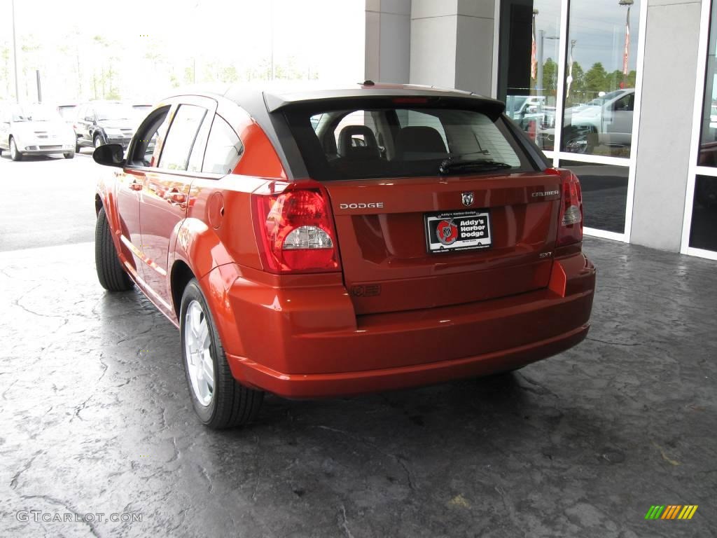 2009 Caliber SXT - Sunburst Orange Pearl / Dark Slate Gray/Red photo #3