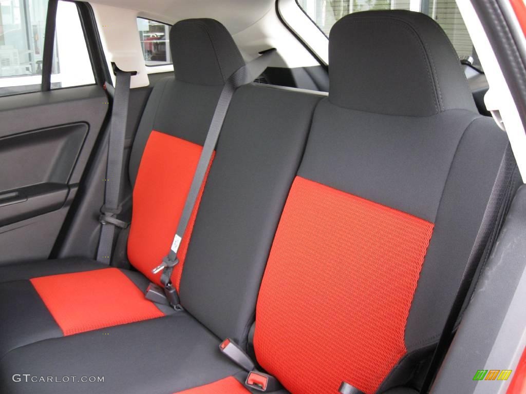 2009 Caliber SXT - Sunburst Orange Pearl / Dark Slate Gray/Red photo #7