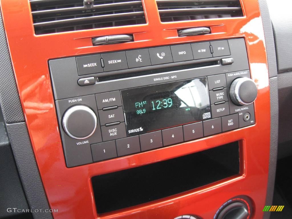 2009 Caliber SXT - Sunburst Orange Pearl / Dark Slate Gray/Red photo #10