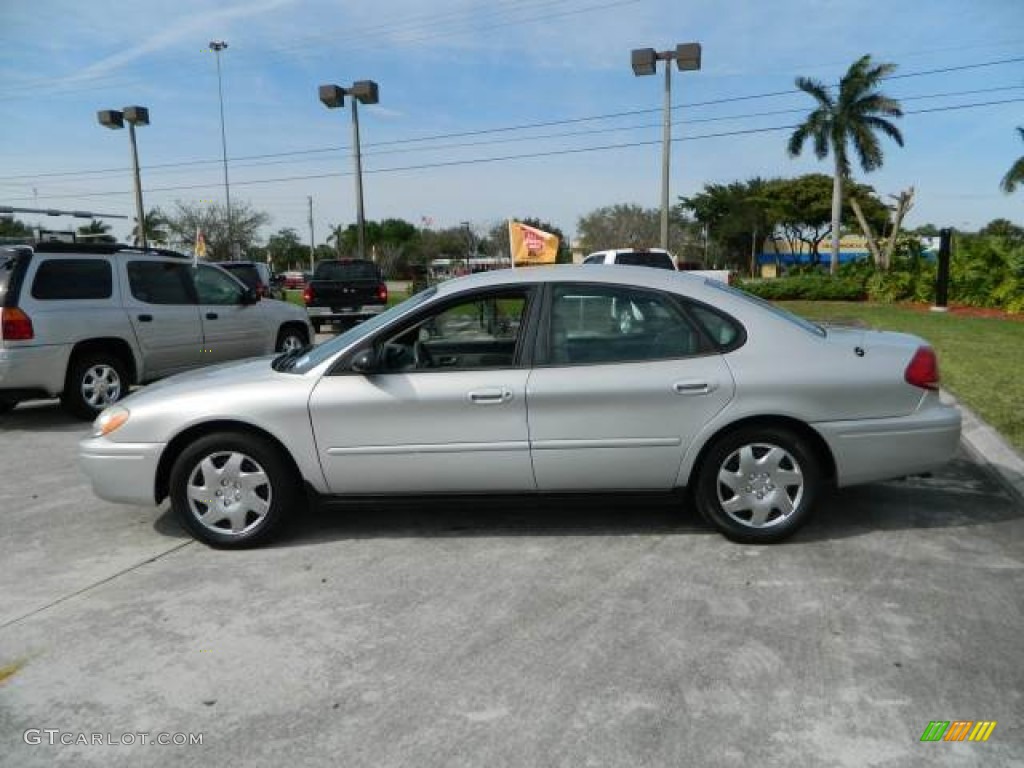 Silver Frost Metallic 2004 Ford Taurus LX Sedan Exterior Photo #77363229