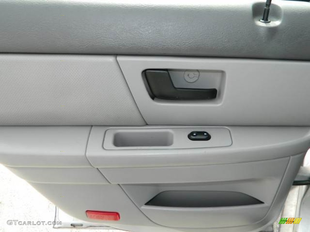 2004 Ford Taurus LX Sedan Medium Graphite Door Panel Photo #77363380