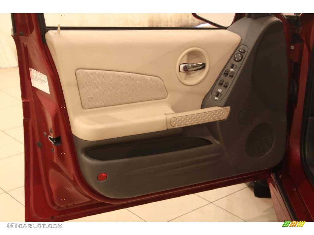 2005 Pontiac Grand Prix GT Sedan Parchment/Dark Pewter Door Panel Photo #77476578