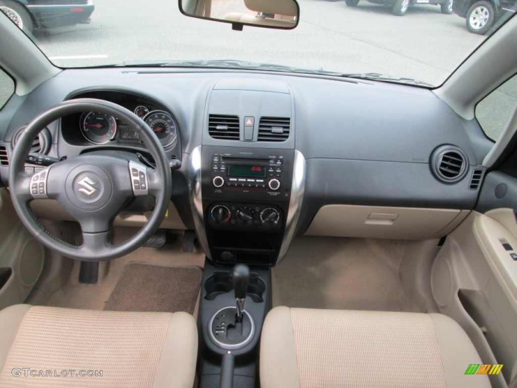2011 Suzuki SX4 Sedan LE Beige Dashboard Photo #77532662