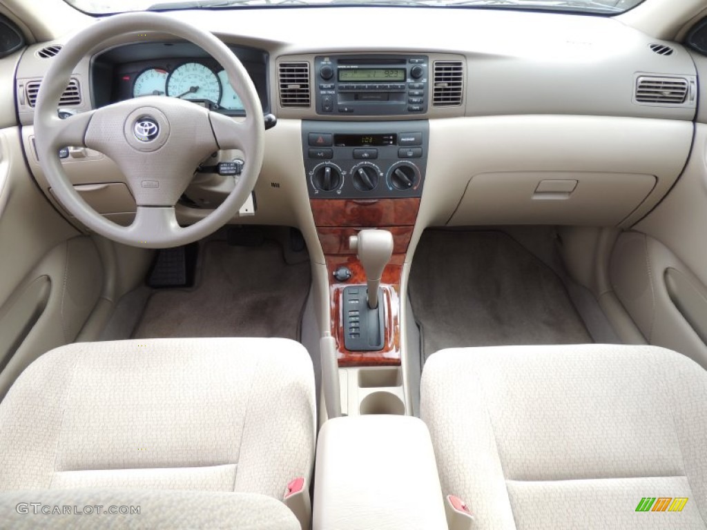 2004 Toyota Corolla LE Pebble Beige Dashboard Photo #77574060
