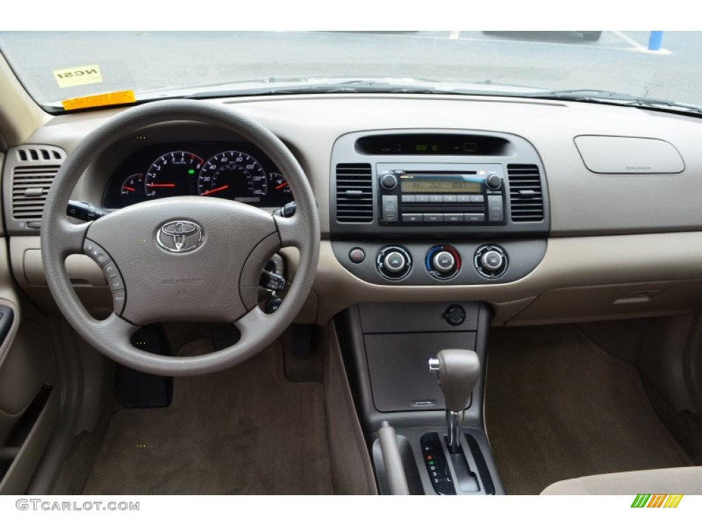 2005 Toyota Camry LE Taupe Dashboard Photo #77647888