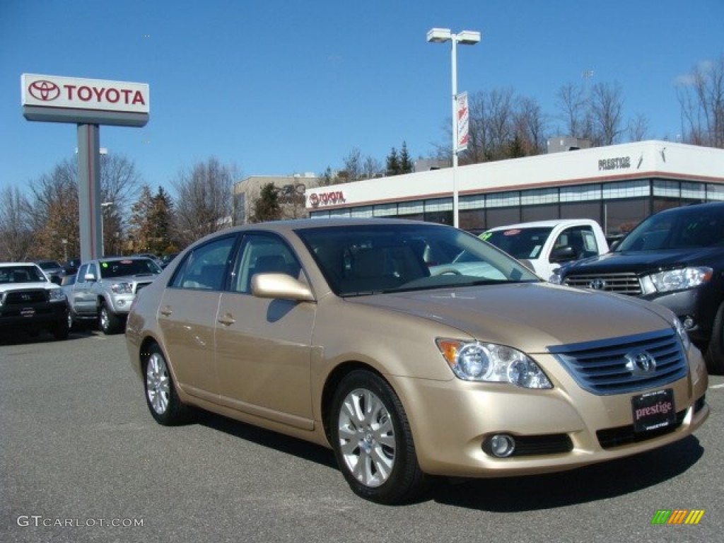 2010 Avalon XLS - Sandy Beach Metallic / Ivory photo #1