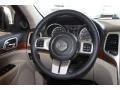 Black/Light Frost Beige 2011 Jeep Grand Cherokee Limited Steering Wheel