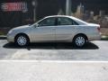 2005 Desert Sand Mica Toyota Camry LE  photo #1