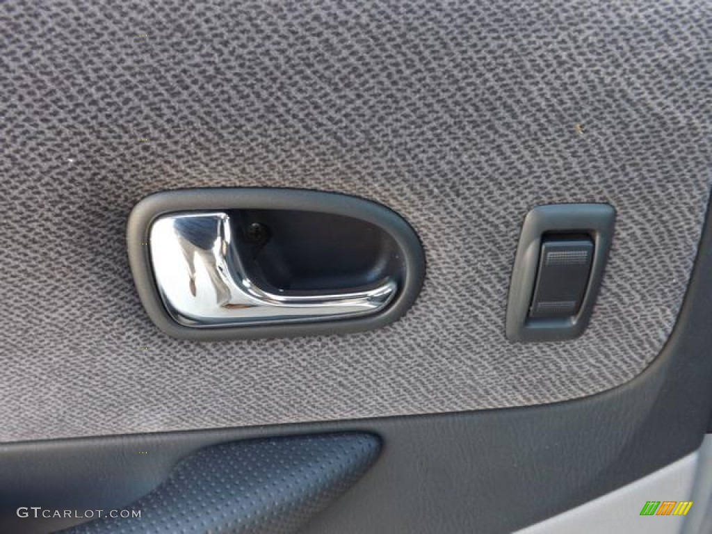 2003 Protege LX - Sunlight Silver Metallic / Off Black photo #33