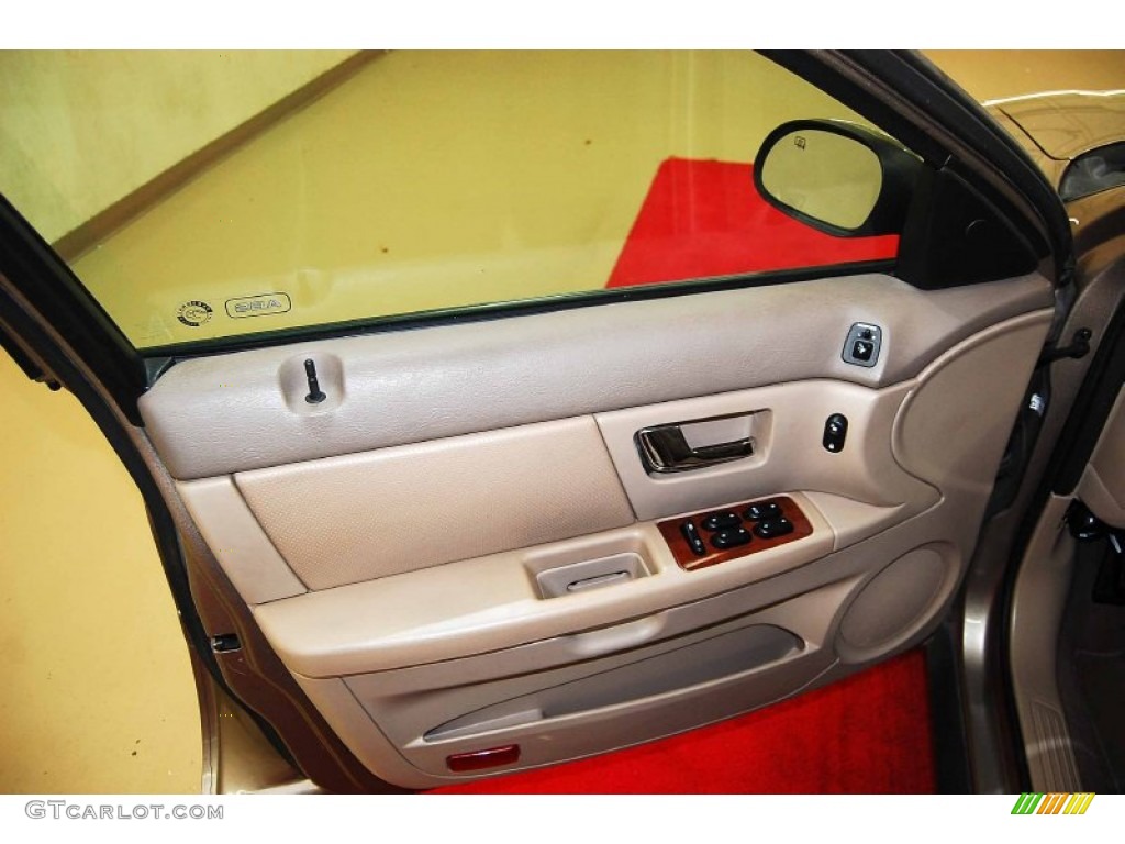 2003 Ford Taurus SEL Medium Parchment Door Panel Photo #78753032