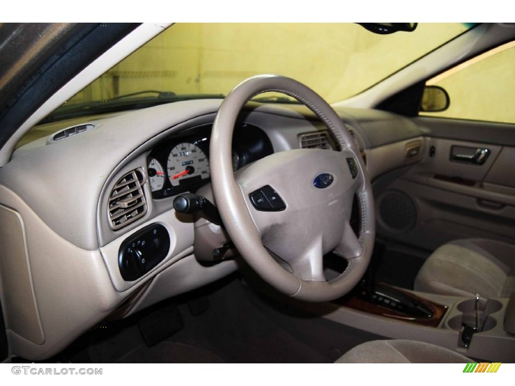 2003 Ford Taurus SEL Medium Parchment Steering Wheel Photo #78753068