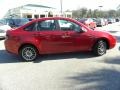 2010 Sangria Red Metallic Ford Focus SES Sedan  photo #13
