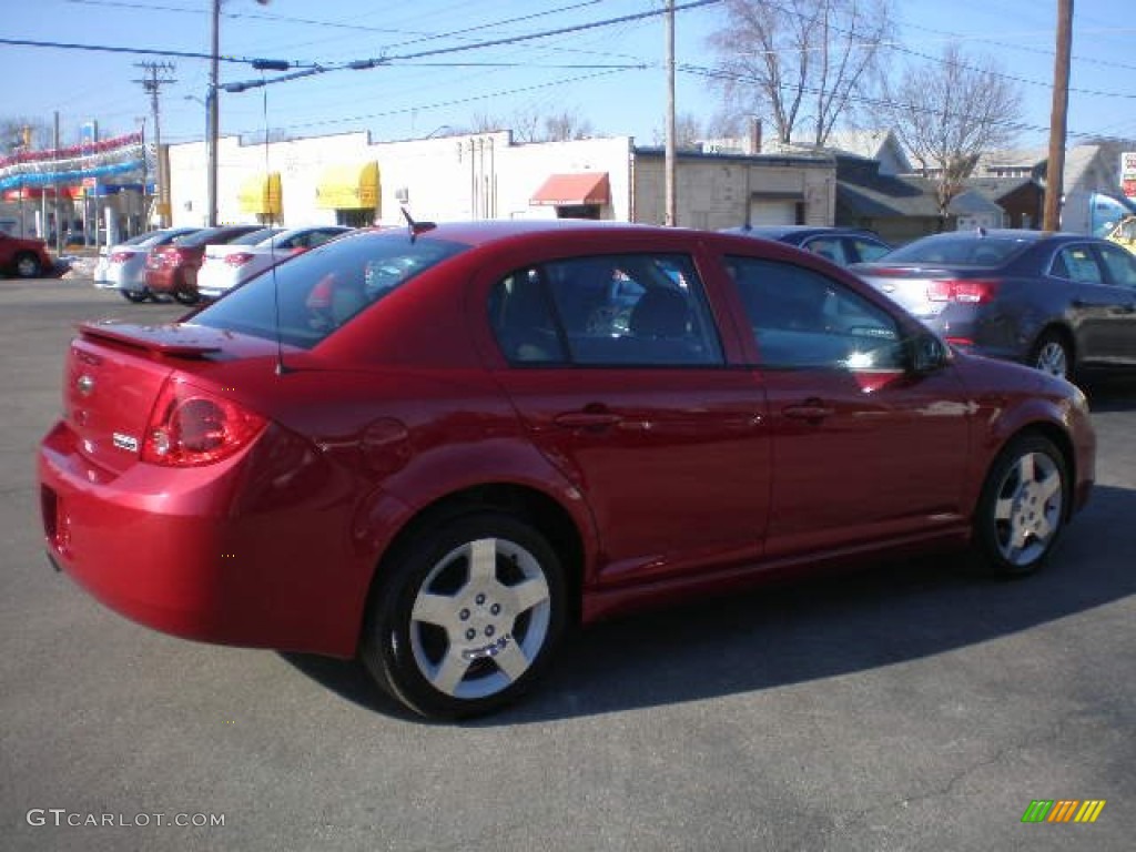 2010 Cobalt LT Sedan - Crystal Red Tintcoat Metallic / Ebony photo #3