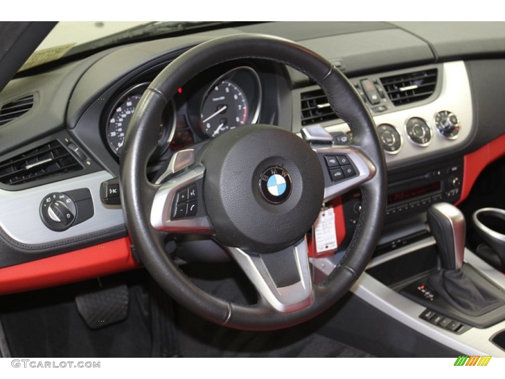 2010 BMW Z4 sDrive30i Roadster Coral Red Steering Wheel Photo #79316792