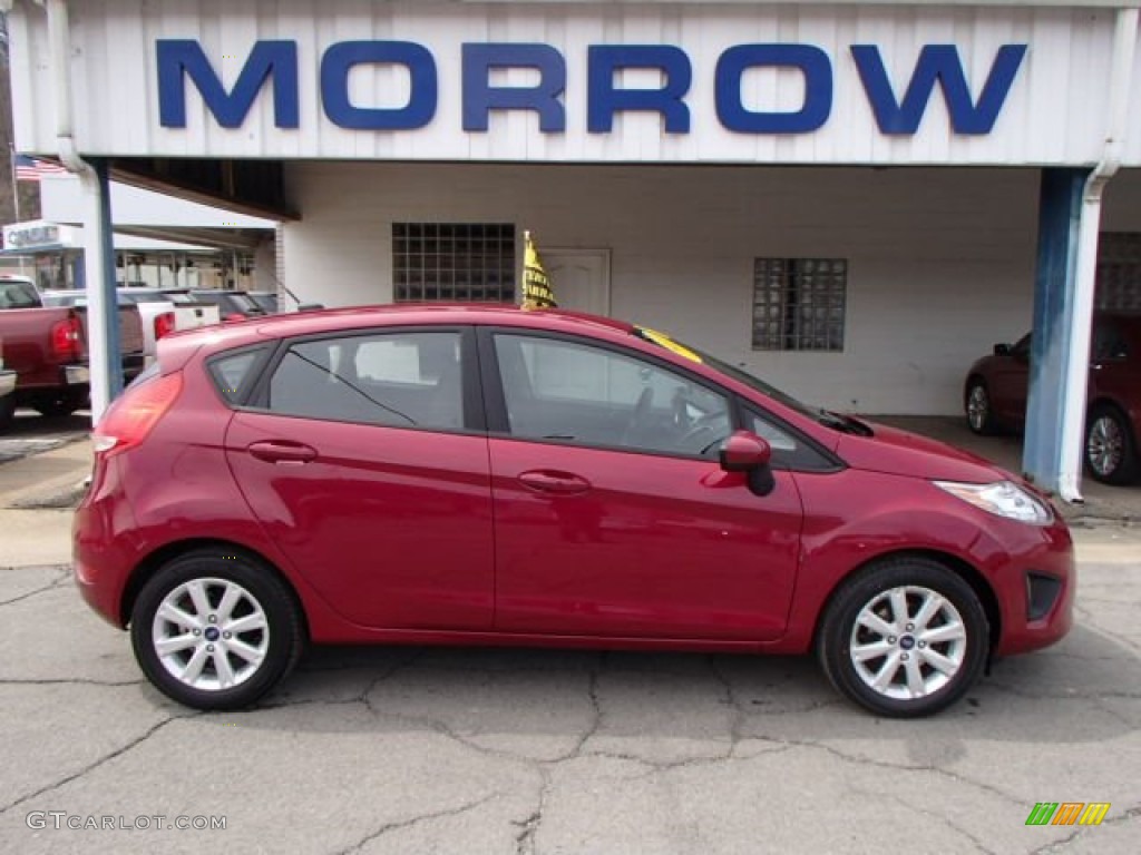 2011 Fiesta SE Hatchback - Bright Magenta Metallic / Charcoal Black/Blue Cloth photo #1