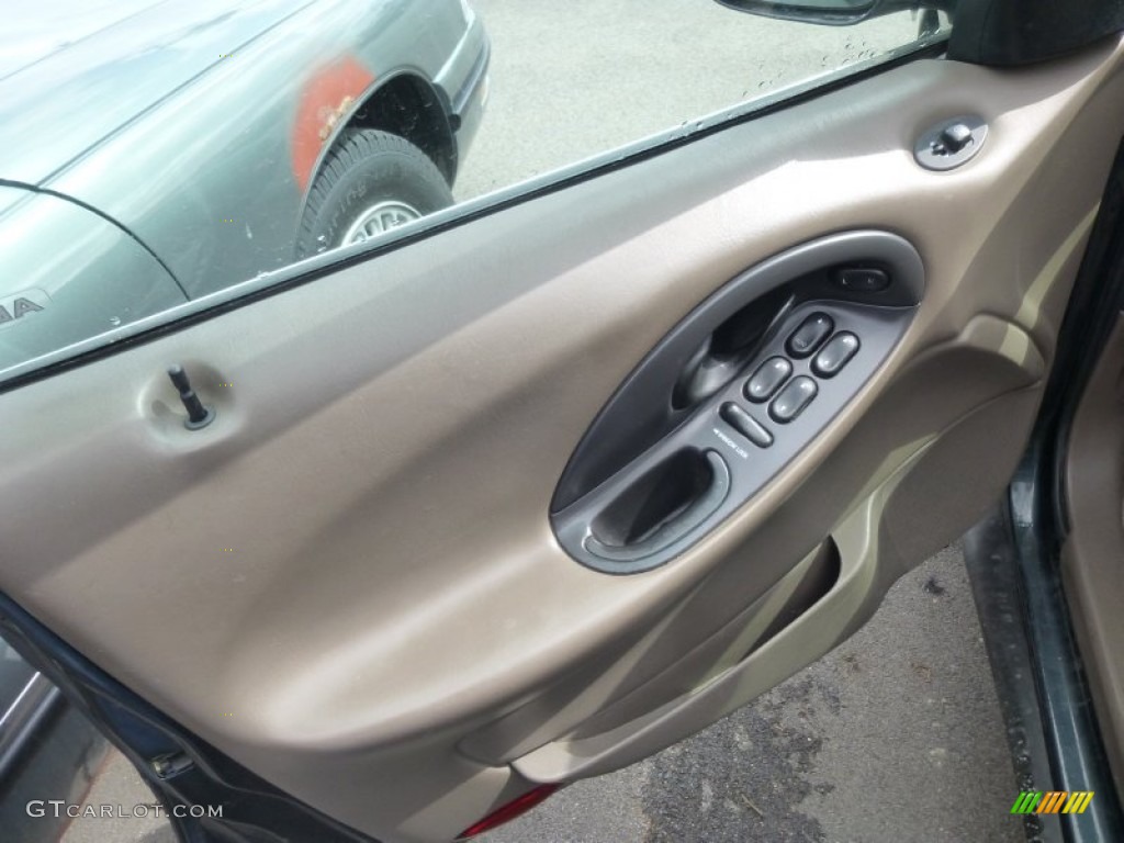 1999 Ford Taurus SE Wagon Medium Prairie Tan Door Panel Photo #79380953